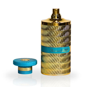 FOREVER BLUE EAU DE PARFUME 100ml BY ARD AL ZAAFARAN - Luxurious gold and blue perfume bottle with cap removed, 3.4oz unisex fragrance