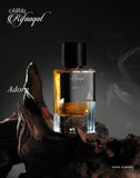 RIFAAQAT ADORN Eau de Parfum 85ml bottle by Paris Corner on a rustic wooden surface with smoky background