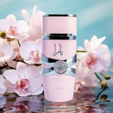 YARA FOR WOMEN EDP BY LATTAFA PERFUMES 100ml bottle surrounded by blooming orchids.