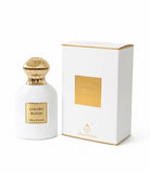 White perfume bottle with gold cap and label next to its packaging box on a white background